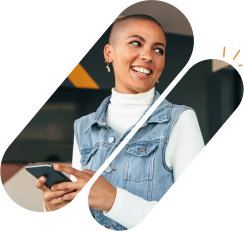 female customer smiling and holding her mobile phone